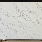Full slab of ST Quartz Arabescato Bianco, a striking quartz that replicates Arabescato marble with its bold, web-like network of grey veins on a white background