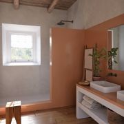 Rustic Mediterranean-style bathroom featuring Silestone Arcilla Red quartz on the vanity top and in the walk-in shower