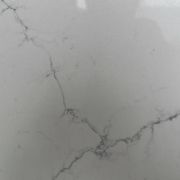 Full slab of ST Quartz Calacatta Finta, a marble-effect quartz featuring a dense and intricate web of fine grey veins on a soft white background
