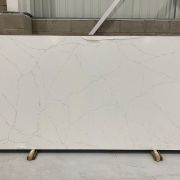 Full slab of ST Quartz Calacatta Finta, a marble-effect quartz featuring a dense and intricate web of fine grey veins on a soft white background