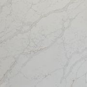 A slab of Nile Quartz Calacatta Gold, a luxurious and warm-toned marble-look quartz, perfect for creating a statement kitchen island