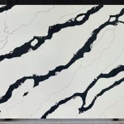 Full slab of ST Quartz Calacatta Panda, a dramatic quartz with bold, flowing rivers of solid black on a crisp white background, replicating Panda Marble