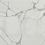 Full slab of ST Quartz Calacatta Ragno, a marble-effect quartz featuring an intricate spider-web network of grey and gold veins on a white background