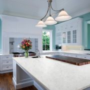 Spacious kitchen installation by S T Stoneworks featuring Nile Quartz Carrara worktops on a large central island and counters