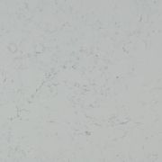 Slab of Nile Quartz Carrara Mist worktop material, featuring a soft off-white base with subtle misty grey veining