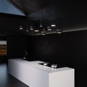 A custom waterfall island fabricated from Silestone Eternal Statuario, demonstrating its use in high-end, minimalist kitchen design, supplied by ST Stoneworks