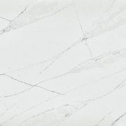 Slab of Silestone Ethereal Noctis quartz, featuring a striking pattern of short, sharp, dark grey veins and textural details on a crisp white background.