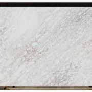 Full slab of ST Quartz Tempest White, featuring a dynamic, stormy pattern of soft grey and taupe veins on a bright white base