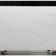 Full slab of ST Quartz Statuario Premium, a classic marble-effect quartz with delicate grey veining on a crisp white background