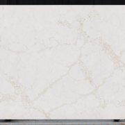 Full slab of ST Quartz Statuario Gold, a warm, marble-effect quartz with a dense and intricate web of soft gold and grey veins on a creamy white base