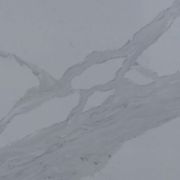 Detailed close-up of ST Quartz Statuary Forte, showcasing the soft, cloudy texture within the bold grey veins against the light grey quartz base