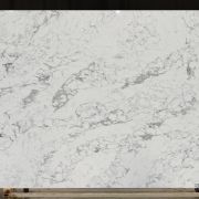 ST Quartz Vagli Leathered, a dramatic marble-effect quartz with a fractured, crystalline pattern of grey and white and a unique, tactile leathered finish