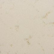 Detailed close-up of ST Quartz Windermere, showcasing the fine, sandy texture and subtle, warm golden-beige veining on a creamy off-white base
