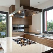 A luxury kitchen design showcasing a Silestone Lusso worktop on a large island