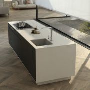 Two-tone kitchen island showcasing a Silestone Miami Vena worktop with waterfall ends, set against dark cabinets and a herringbone floor