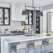 Sophisticated kitchen design showcasing a subtle Silestone Snowy Ibiza quartz worktop on a large island, beautifully complementing two-tone grey shaker cabinets