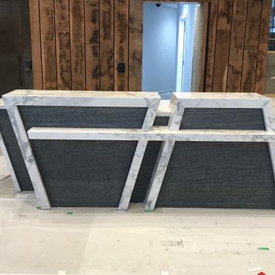 ST Stoneworks were asked to make this unique, award winning reception desk in Natural Marble and Granite.