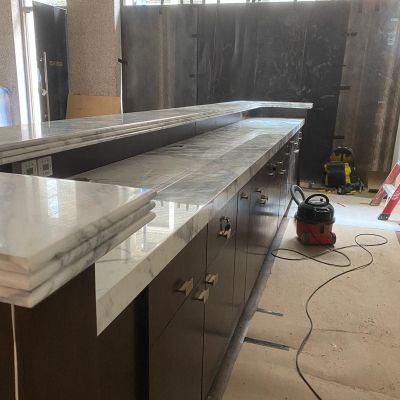 ST Stone Works were asked to make a 4.6 metre bar top in marble with a special edge detail.