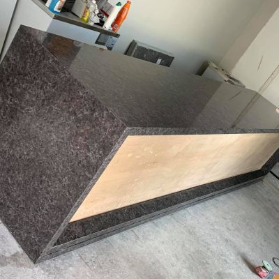 A bespoke reception desk in hard wearing Quartz for Matt Roberts Mayfair Gym.