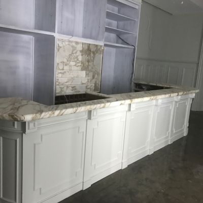 We were asked to repair and polish the bar top, and make new bottle stands and extra bar tops to match the marble on the bar.